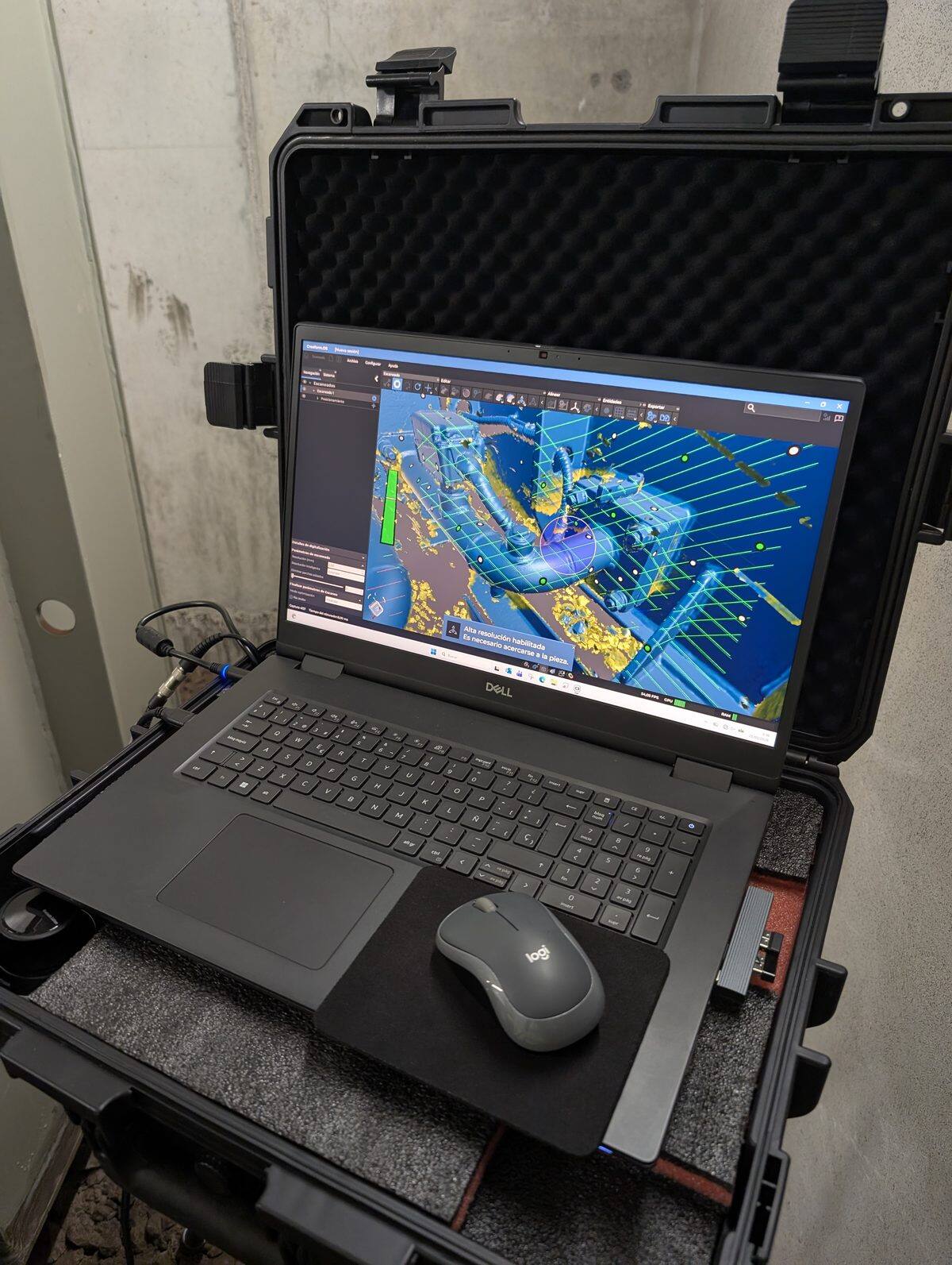 Laptop displaying the resulting 3D model from scanning with point clouds and visible targets